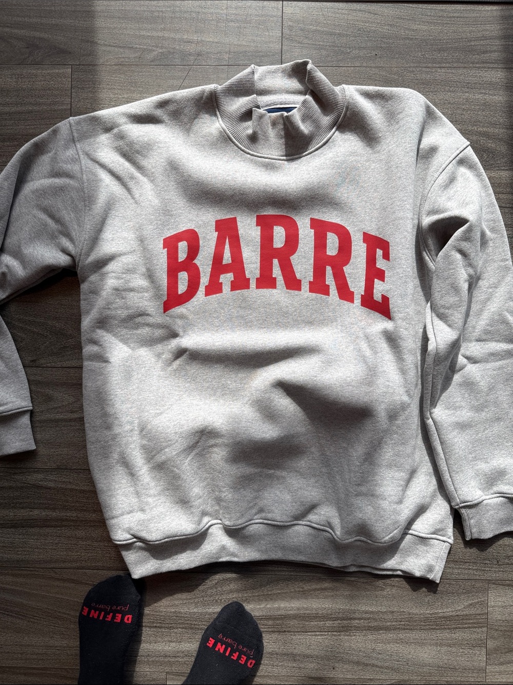 Barre Gray Mockneck Sweatshirt with Red Logo. Sleeve says Pure Barre Broadripple